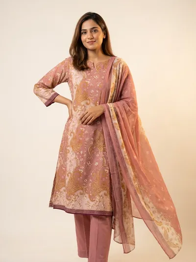 The fabric stitched as an A-line kameez with a draped dupatta.