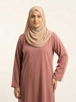 House model: Pakistani woman in her thirties wearing a beige hijab.