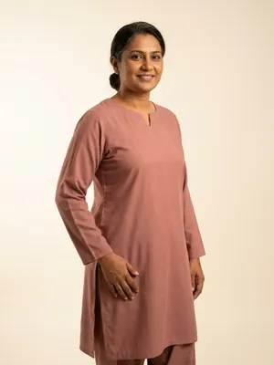 House model: Pakistani woman in her forties, medium-brown complexion, hair in a low bun.